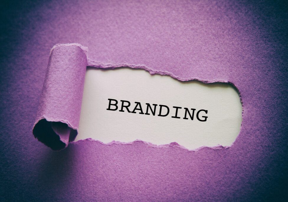 Branding written under torn paper.